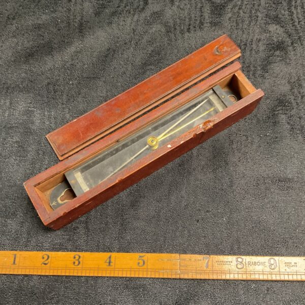 Vintage military trough compass for surveying and navigation.
