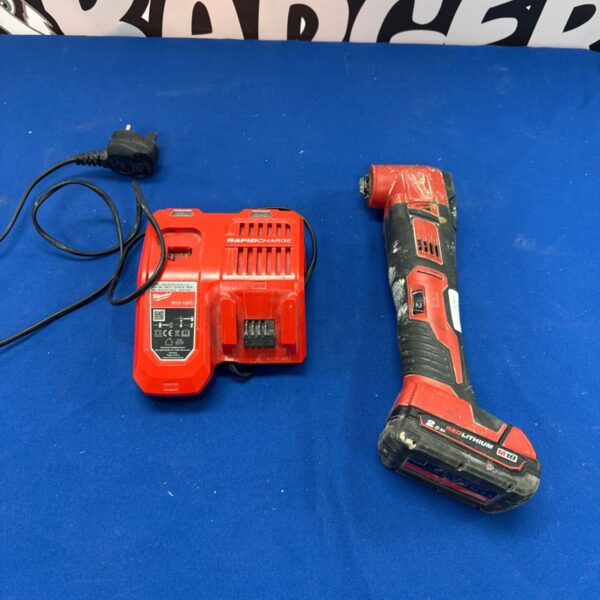 Milwaukee M18 power tool with charger and battery for repair.
