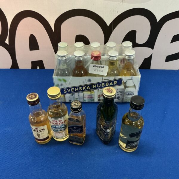 Assorted mini alcohol bottles including Svenska Nubbar and Bells whisky.