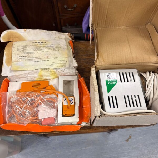 Vintage mini orange Aspen Universal pump in as-found condition.
