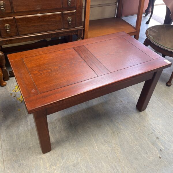 Vintage Mission Style coffee table with reddish-brown finish.