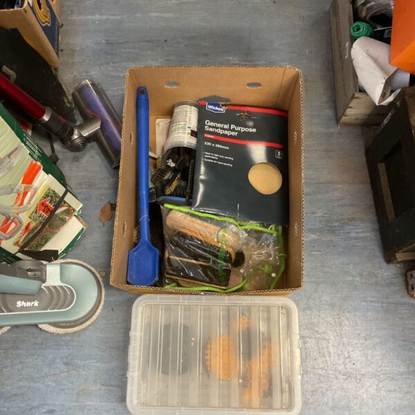 Mixed appliance lot with sandpaper and brushes for DIY projects.
