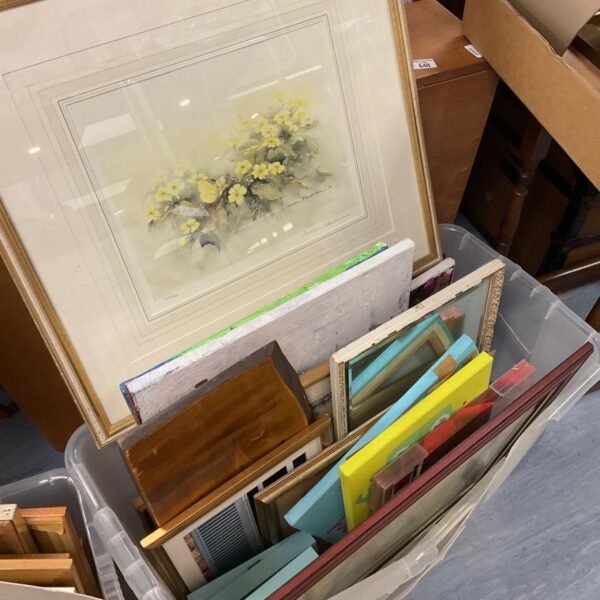 Box of mixed artwork including a watercolour painting and framed prints.