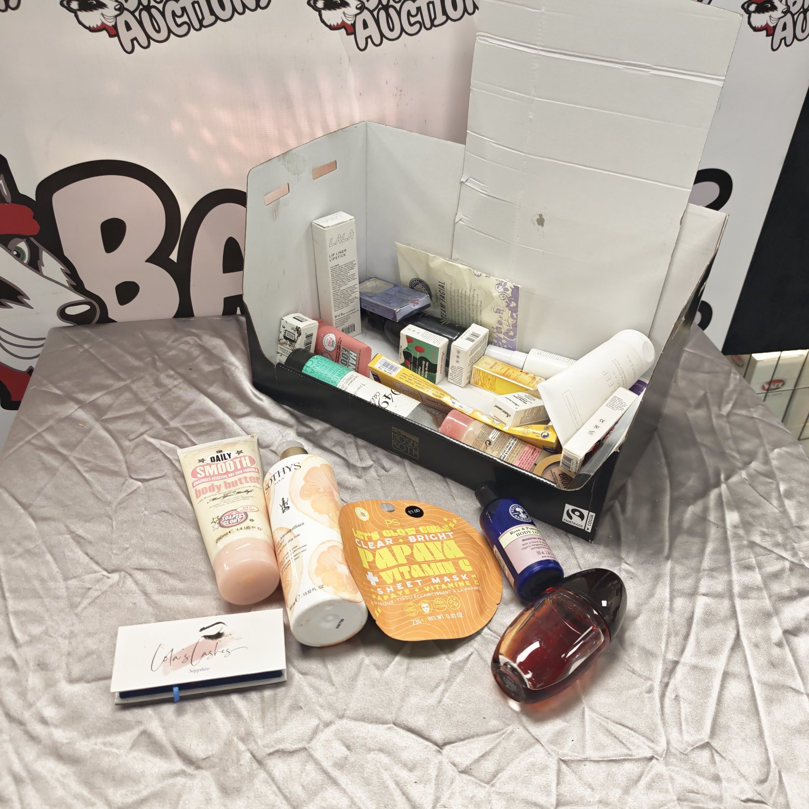 Mixed beauty product lot with Calvin Klein and The Daily Smooth.