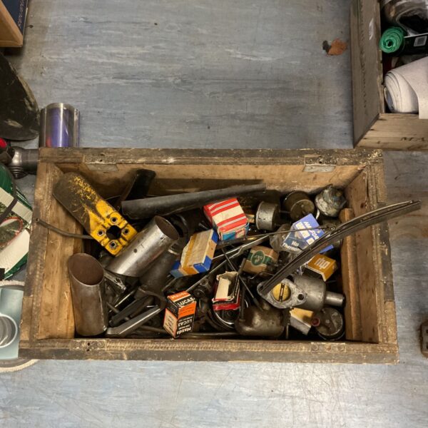 Mixed lot of vintage car parts including exhaust and bulbs.
