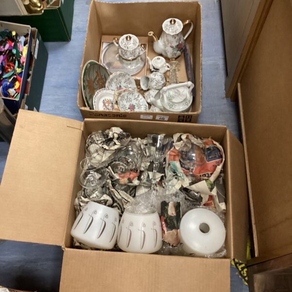 Mixed china and glass lot in crates, vintage collectibles.