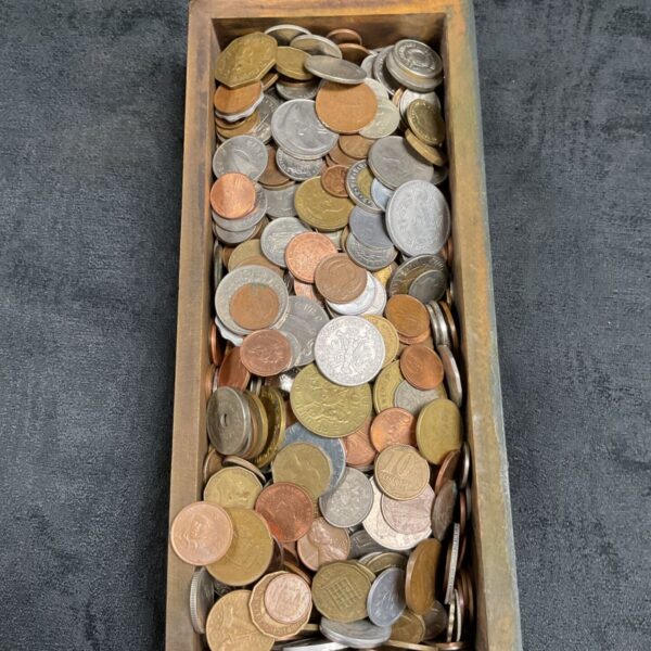 Tray of mixed vintage coins for collectors and enthusiasts.