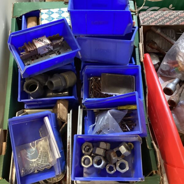 Tray of mixed fixings including screws, nuts and wall plugs.