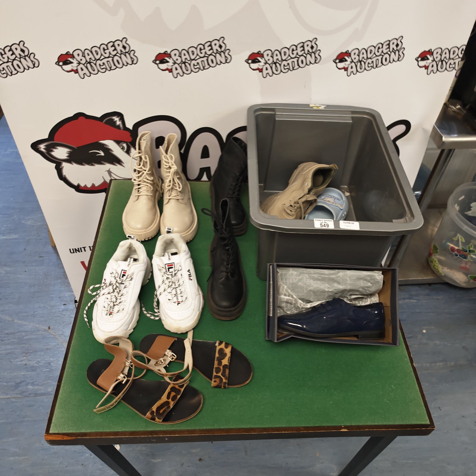 Mixed footwear lot including Fila trainers, Zara boots and Clarks shoes.