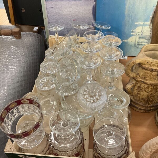 Tray of mixed vintage glassware with assorted glass styles.