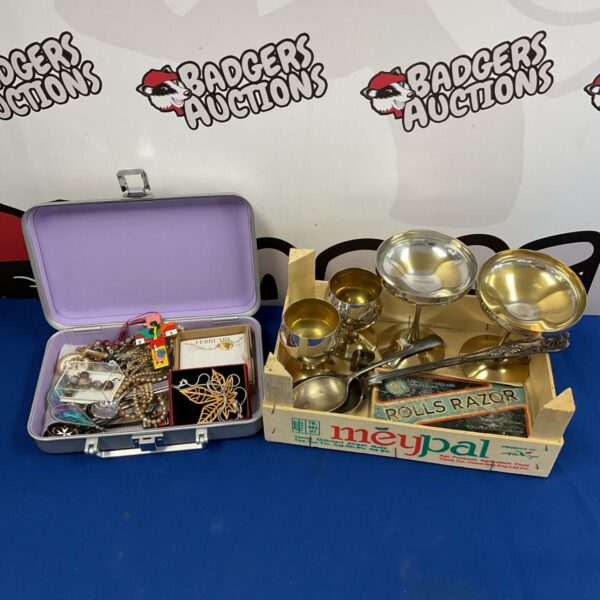 Vintage mixed jewellery and silver plate lot in a lilac suitcase.
