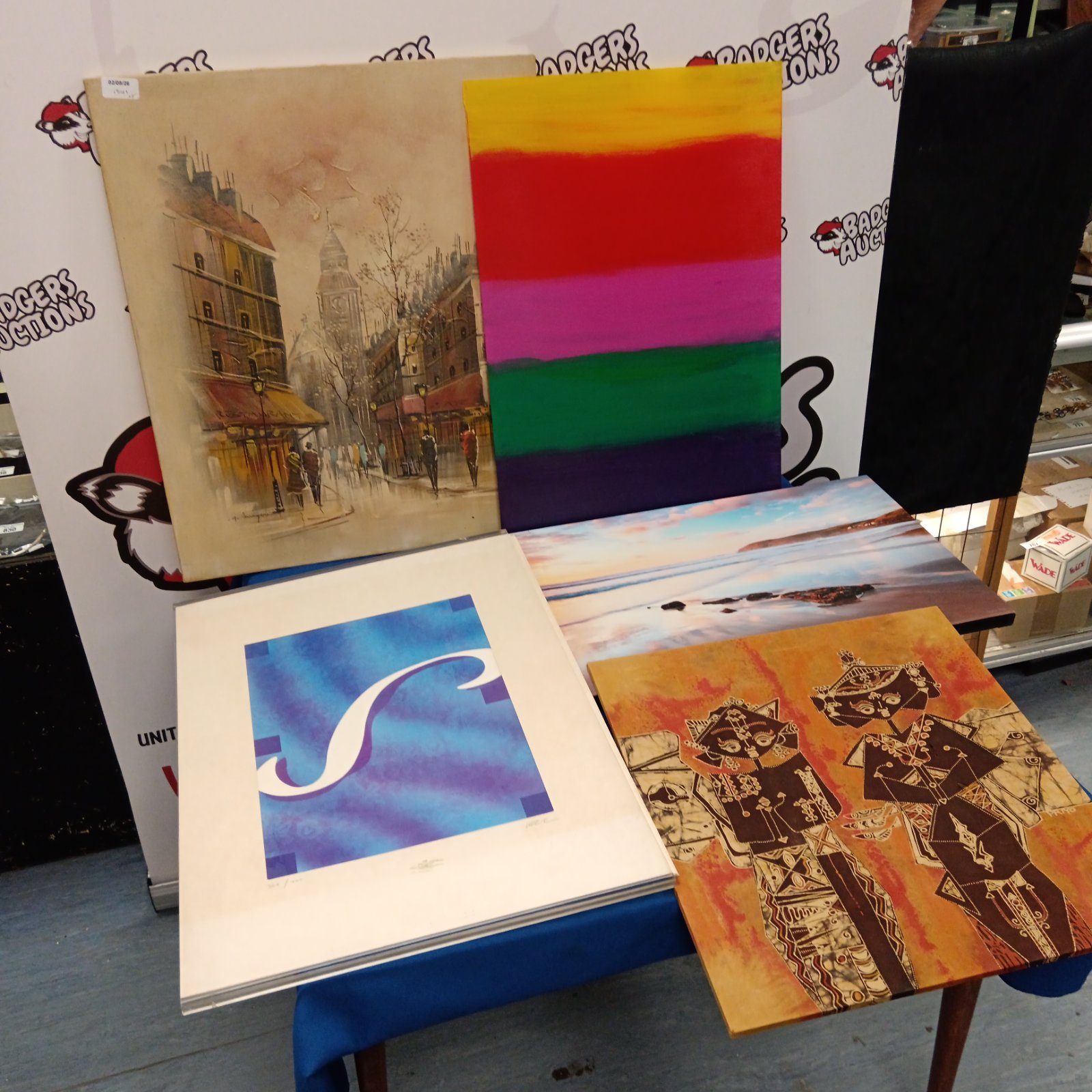 Vintage street scene print within a mixed lot of artworks.