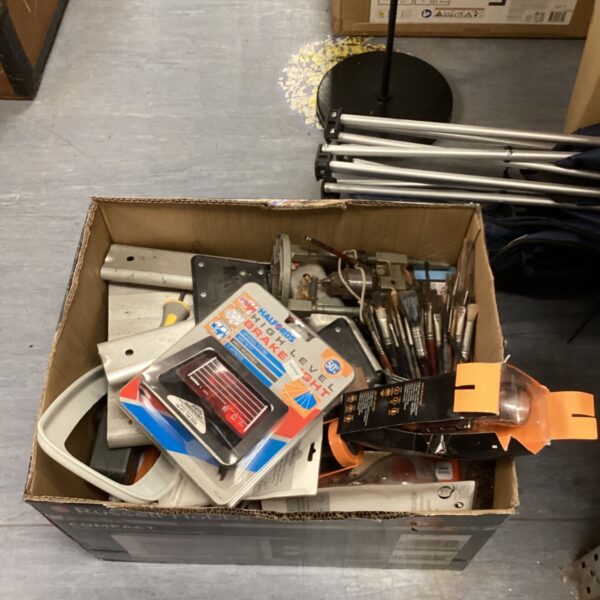 Mixed lot of car parts and paint brushes in a cardboard box.
