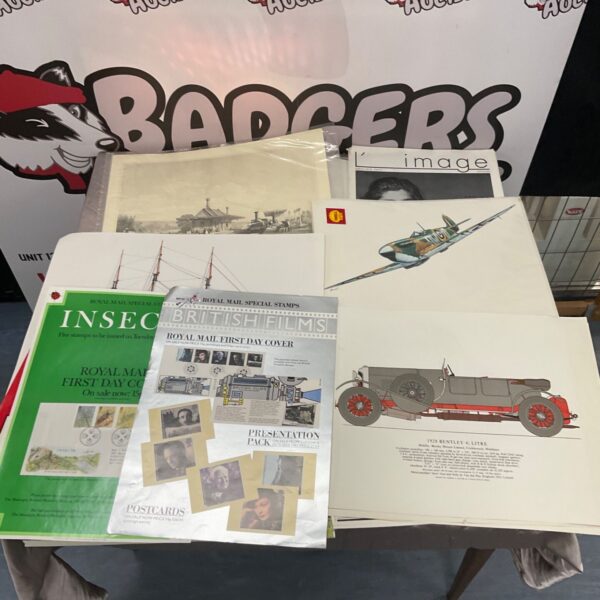 Mixed lot of vintage stamps and posters for collectors.