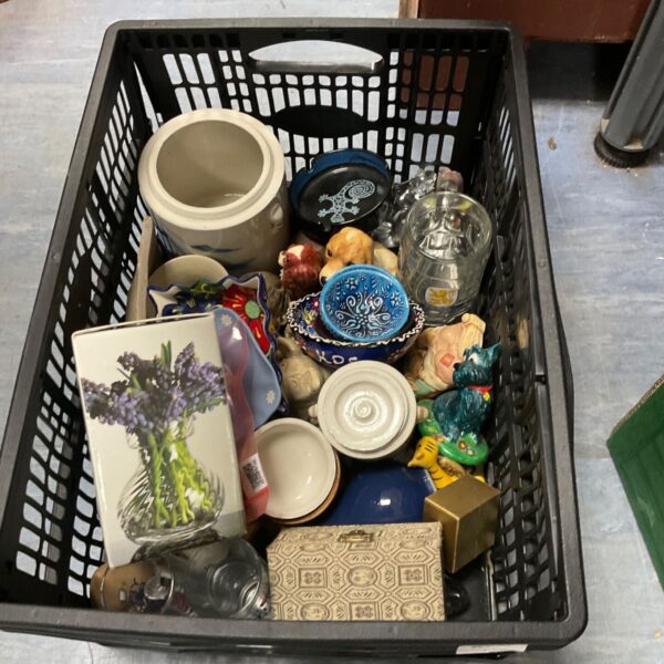 Mixed lot of vintage ornaments and collectible figures on display.