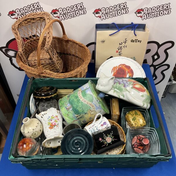 Mixed pottery and collectible lot with wicker basket and figurines.
