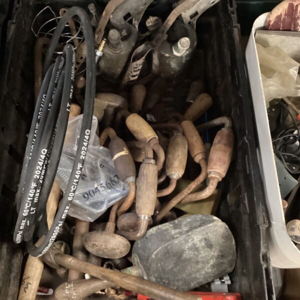 Mixed tool lot featuring a blowtorch and hammer for garden or workshop use.