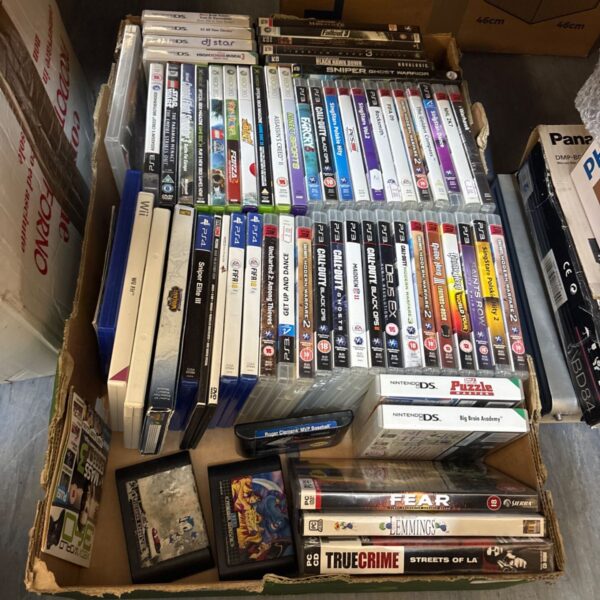 Crate full of mixed video games for various consoles.
