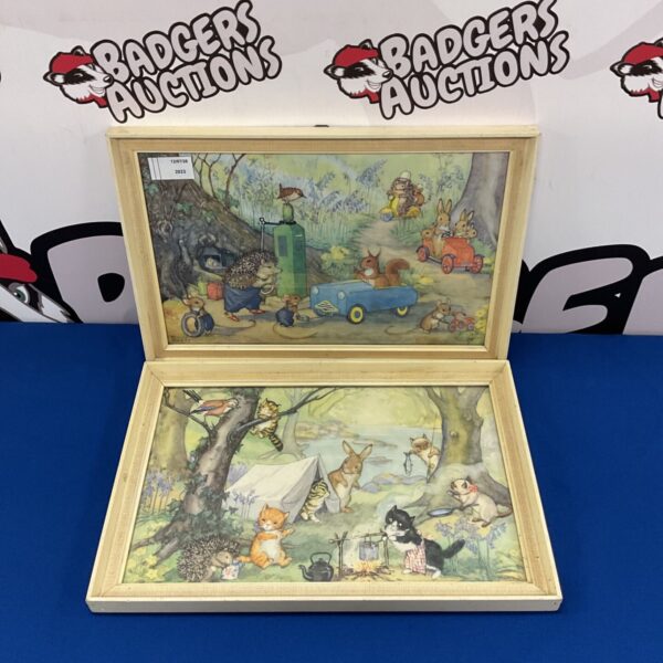 Vintage Molly Brett nursery prints depicting a charming animal scene.