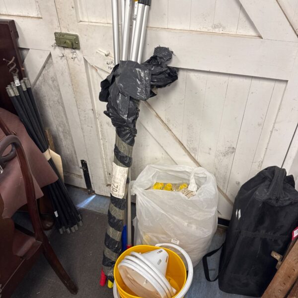 Lot of six mop handles, new mop heads, and three yellow buckets.
