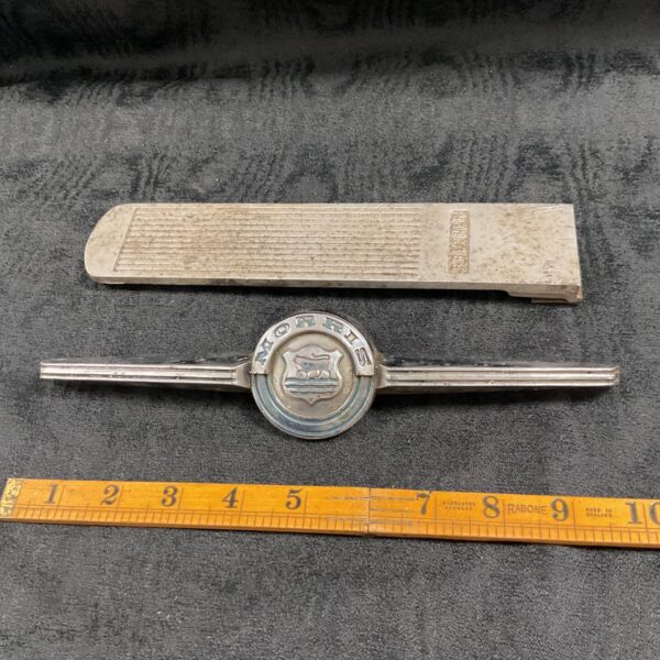 Vintage Morris Mini bonnet badge with bull emblem.