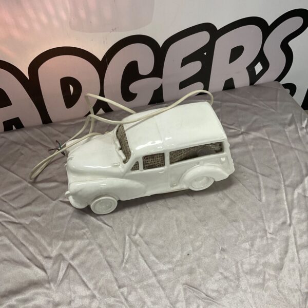 Vintage porcelain Morris Traveller lamp, a collectible automotive piece.