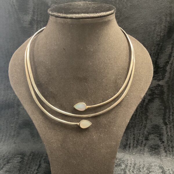 Elegant sterling silver choker necklace with mother of pearl pendant.