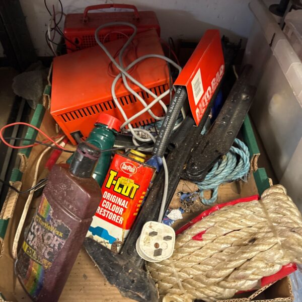 Tray of vintage motoring collectibles including a battery charger.