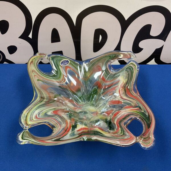 Vibrant Murano glass fruit bowl with red, green, and white swirls.