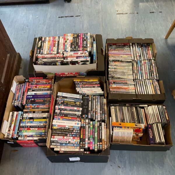Large lot of music CDs and DVDs for sale.