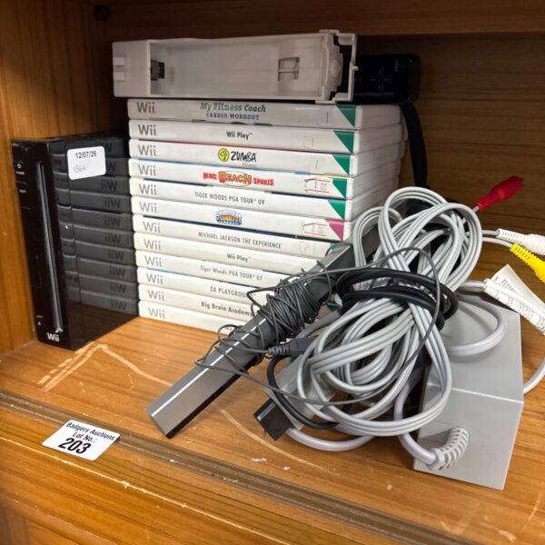 Nintendo Wii console with games and accessories displayed.