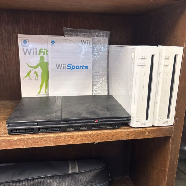 Nintendo Wii and PlayStation 2 console lot with manuals.