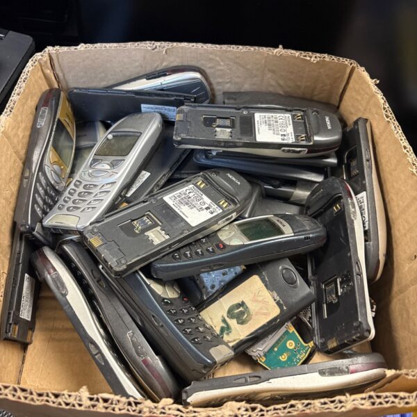 Box of vintage Nokia mobile phones for repair and collecting.