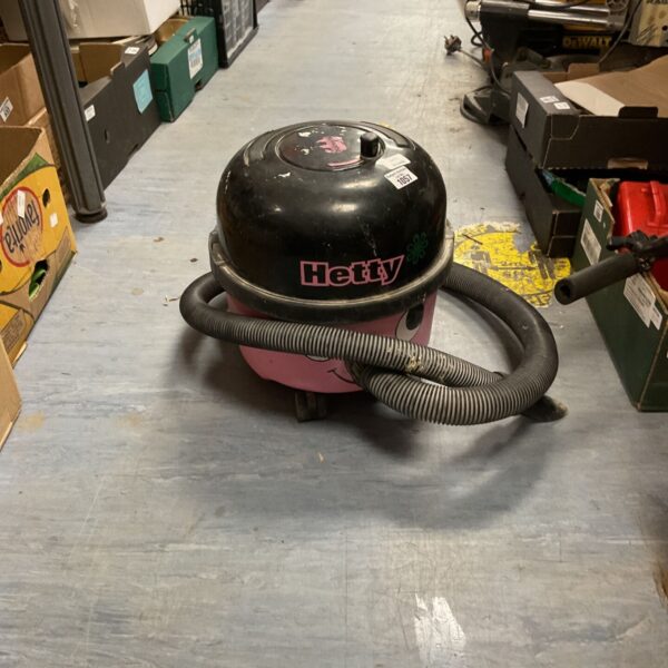 Numatic Hetty vacuum cleaner with hose and attachments.