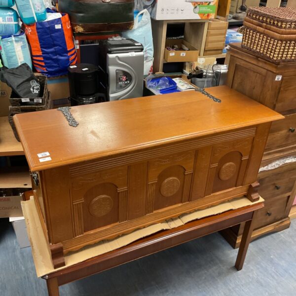 Vintage solid oak blanket chest with detailed seahorse carvings.