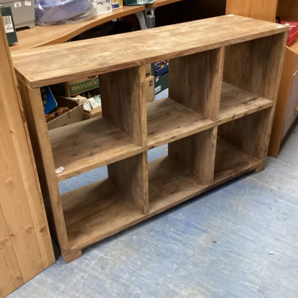 Vintage oak bookcase with three shelves, ideal for home storage.