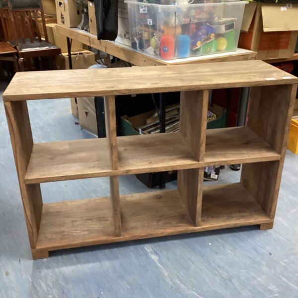 Vintage oak bookcase with four shelves for home storage.