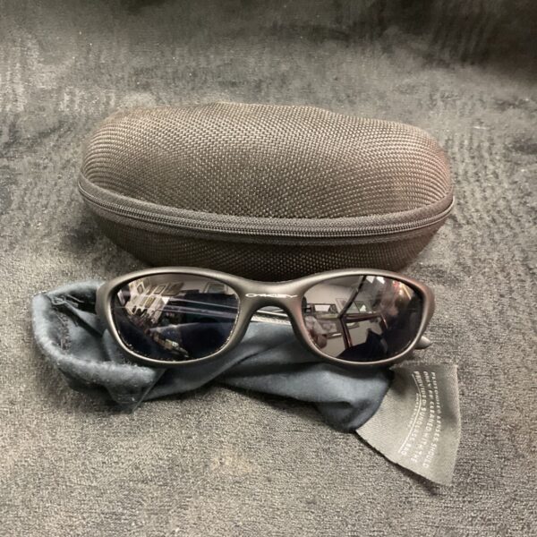 Used Oakley sunglasses with reflective lenses and included case.