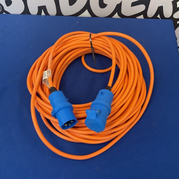 Orange mains hookup cable for caravan or motorhome electrical connection.