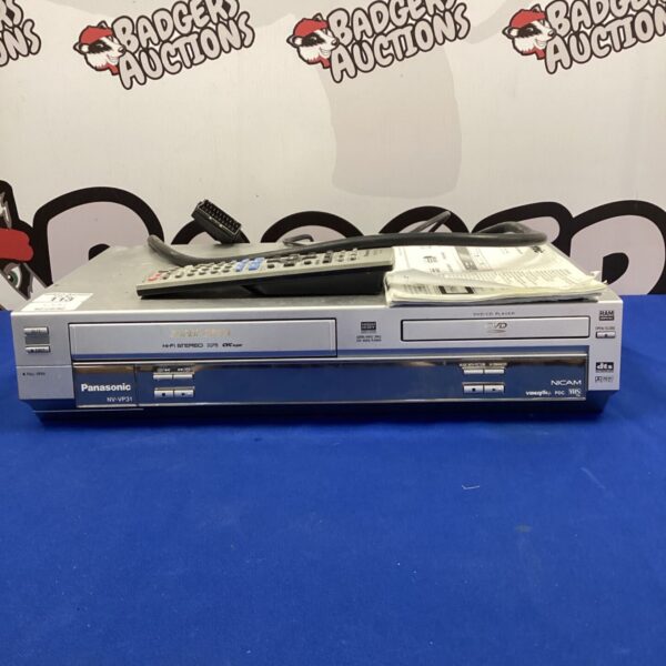 Panasonic NV-VP31 DVD VHS combo player with remote control.