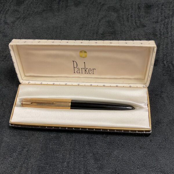 Vintage gold plated Parker fountain pen, classic writing instrument.
