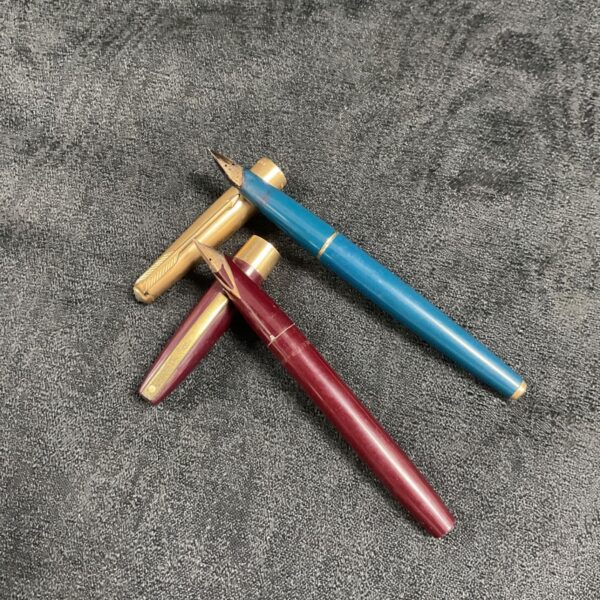 Vintage Parker and Sheaffer fountain pens with 14ct gold nibs.