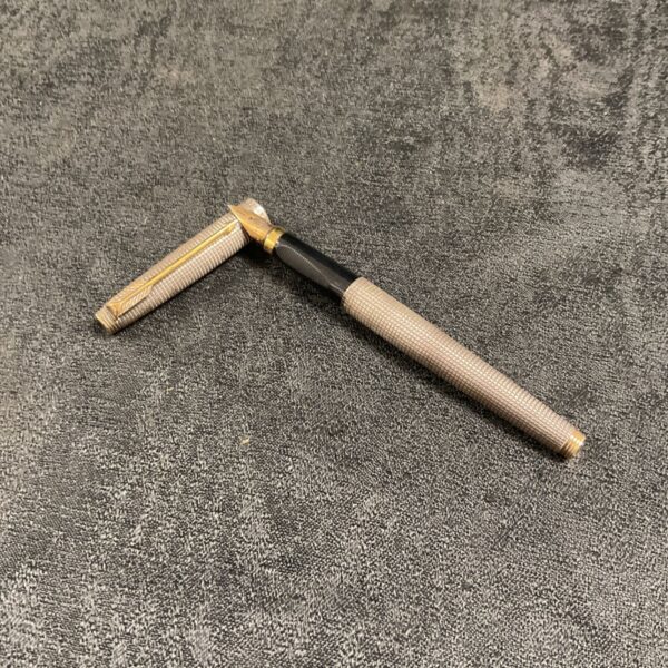 Vintage sterling silver Parker pen with gold accents.
