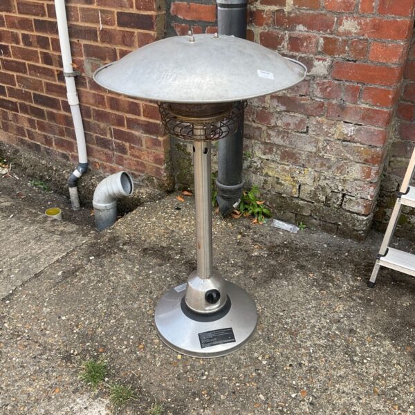 Stainless steel tabletop gas patio heater for outdoor use.