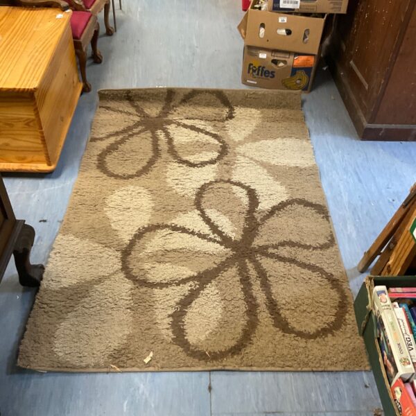 Vintage patterned rug with a floral design, approximately 5x3 feet.