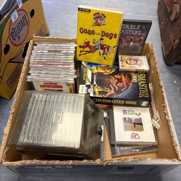Mixed lot of vintage PC games and music CDs for collectors.