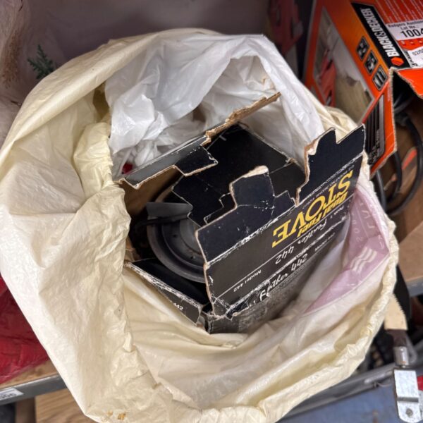 Used Peak Performance 442 camping stove with damaged packaging.