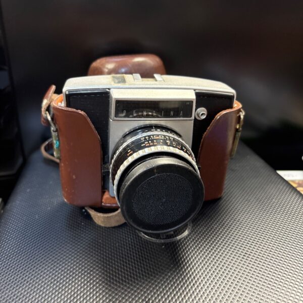 Vintage Pentacon Pentina 35mm SLR camera with case.