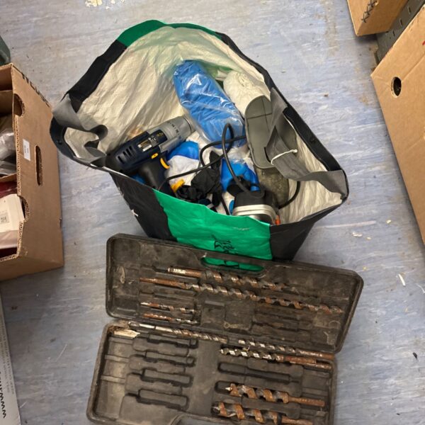 Performance Pro cordless drill set with charger and batteries in a bag.