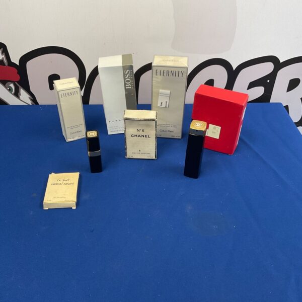Selection of designer perfumes including Chanel No.5, Eternity, and Boss.